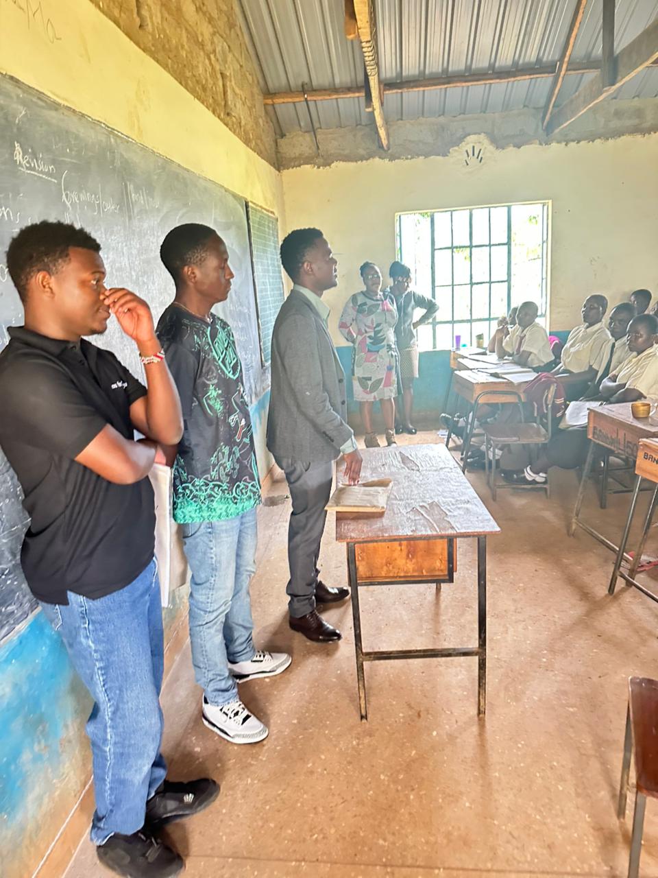 Team addressing students in a classroom